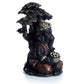 Black and Gold Ganesh Sitting Under Tree